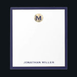 Navy Blue Brushed Gold Monogram Notepad<br><div class="desc">Elevate your note-taking game with this luxurious personalised notepad featuring a brushed metallic gold monogram initial at the top and your name in classic typography at the bottom, elegantly framed in navy blue trim. Perfect for jotting down ideas, taking notes or making lists, this notepad makes a great gift for...</div>
