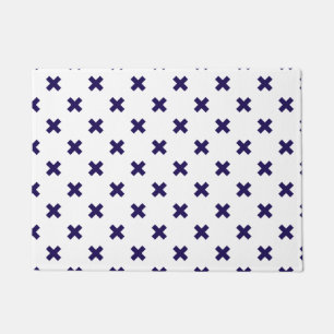 Navy blue cross stitches on white doormat