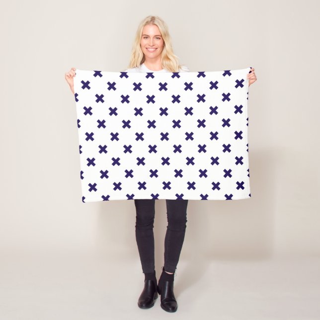 Navy blue cross stitches on white fleece blanket (In Situ)