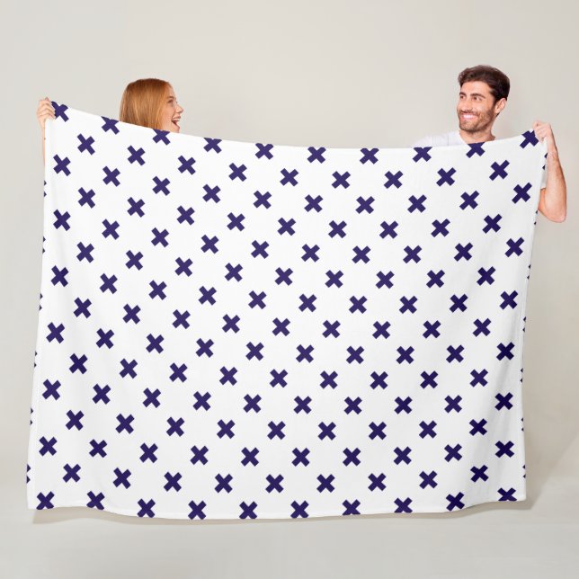 Navy blue cross stitches on white fleece blanket (In Situ)