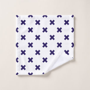 Navy blue cross stitches on white wash cloth