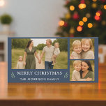 Navy Blue Merry Christmas 3 Photo Botanical  Holiday Card<br><div class="desc">Send classic holiday cheer with this elegant navy blue Christmas card. The 8×4 panoramic layout highlights three family photos, a timeless “Merry Christmas” message in soft ivory text, and delicate botanical sprigs for a refined seasonal touch. The back of the card features a coordinating greenery pattern, creating a polished, professional...</div>