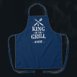 Navy Blue Personalized King of The Grill Apron<br><div class="desc">A fun grilling apron with a bold “King of the Grill” graphic and crossed BBQ tools. Add any name under the design to make it personal. The dark background hides spills and the print has that classic backyard-BBQ vibe. Easy gift for dads, uncles, grandpas, and anyone who lives by the...</div>