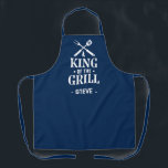 Navy Blue Personalized King of The Grill Apron<br><div class="desc">A fun grilling apron with a bold “King of the Grill” graphic and crossed BBQ tools. Add any name under the design to make it personal. The dark background hides spills and the print has that classic backyard-BBQ vibe. Easy gift for dads, uncles, grandpas, and anyone who lives by the...</div>