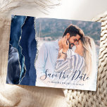 Navy Blue Silver Agate Custom Photo Save the Date Postcard<br><div class="desc">This elegant horizontal save the date postcard features a navy blue watercolor agate border trimmed with faux silver glitter. Easily replace the sample image with your own photo of the future bride and groom. The customizable text combines dark navy blue handwriting script and copperplate font; a white gradient filter helps...</div>