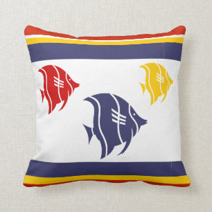 navy blue, yellow, and red fish on white cushion