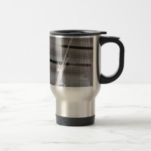 Negative image of a lizard on a window screen travel mug