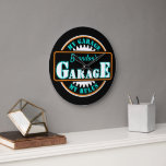 Neon Orange Turquoise Blue Garage Text on Black Large Clock<br><div class="desc">Beautiful contemporary retro wall art clock with bright orange, aqua turquoise blue green, and white coloured typography script on a black background. With room to customise or personalise with a name and text of your choice. This whimsical hipster design is made for the trendy man who has a mancave, or...</div>