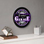 Neon Purple White Garage Text on Black Clock<br><div class="desc">Beautiful contemporary retro wall art clock with bright purple, and white coloured typography script on a black background. With room to customise or personalise with a name and text of your choice. This whimsical hipster design is made for the trendy man who has a mancave, or basement garage space where...</div>