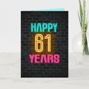 Neon sign on brick for 61st birthday card
