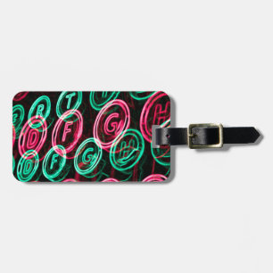 Neon typewriter keys close up luggage tag