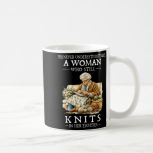 Never underestimate a woman who still knits  coffee mug