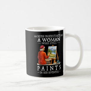 Never underestimate a woman who still paints  coffee mug