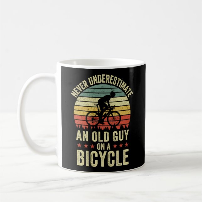 Never Underestimate An Old Guy On A Bicycle Cyclin Coffee Mug (Left)