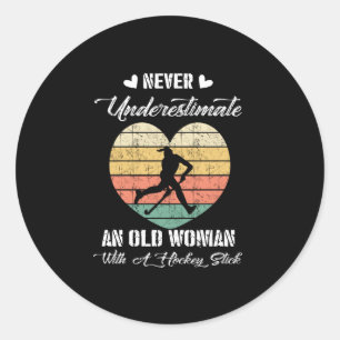 Never Underestimate And Old Woman With A Hockey Classic Round Sticker