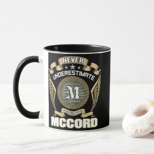 NEVER_UNDERESTIMATE_POWER_OF_A_MCCORD MUG
