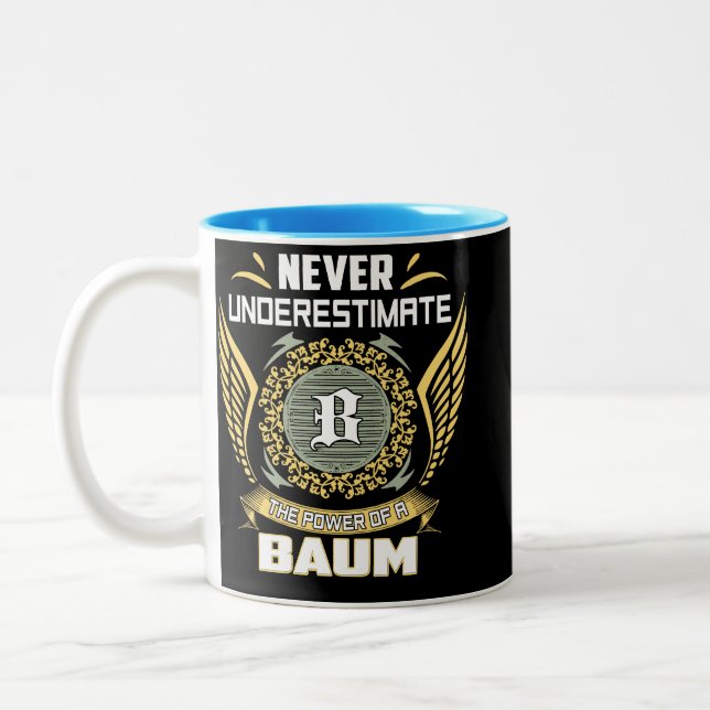 Never Underestimate The Power Of A Baum Two-Tone Coffee Mug (Left)
