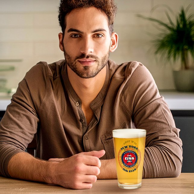 New York Circular Typography Design Glass (A young man sits with the New York glass designed by The American Family.)
