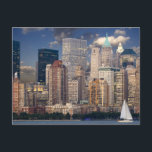 New York City Skyline Postcard<br><div class="desc">Fabulous photo of the New York city skyline in the evening. The image has a sail boat on the waterfront in the foreground and the background is populated with the many interesting bright and shiny skyscrapers and buildings, The photo was taken at dusk when the evening sky has a twilight...</div>