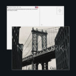 New York, USA Travel Postcard<br><div class="desc">Send this beautiful postcard to your loved ones featuring a dramatic view of the Manhattan Bridge framed symmetrically by the industrial brick buildings of DUMBO.</div>