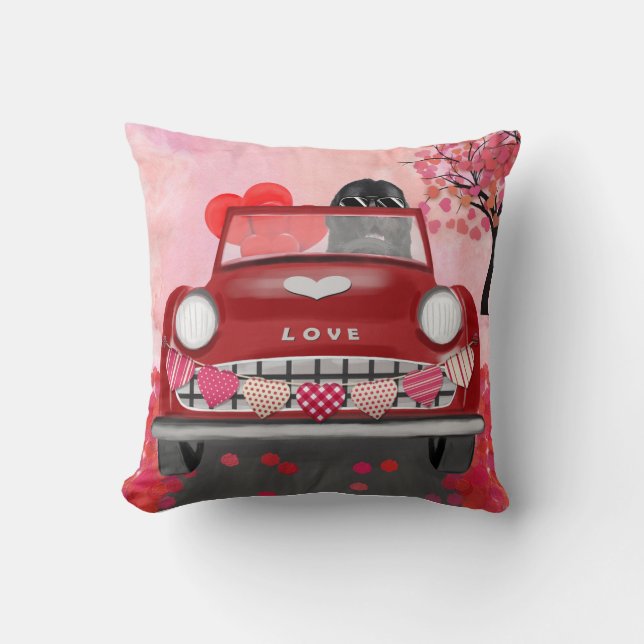 Newfoundland in car with hearts cushion (Front)