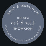 Newlyweds Return Name Address Dusty Navy Blue Classic Round Sticker<br><div class="desc">Newlyweds Return Name Address Dusty Navy Blue> A modern fully customisable typographical design with your names curved above and your return address curved below and text in the middle The New Mr and Mrs And your married name on a dusty navy blue background. All the text can be easily personalised....</div>