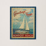 Newport Beach Sailboat Vintage Travel California Jigsaw Puzzle<br><div class="desc">This Greetings From Newport Beach California vintage travel nautical design features a boat sailing on the water with seagulls and a blue sky filled with gorgeous puffy white clouds.</div>