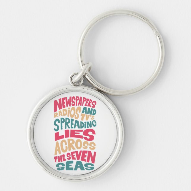 Newspapers radios and Tv´s spreading lies across t Key Ring (Front)