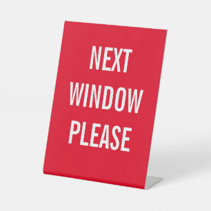 Next window please pedestal sign