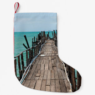 Nice wooden bridge with blue sea background at Sam Small Christmas Stocking