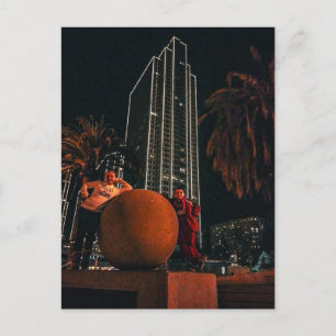 Nighttime City Skyscraper with Orange Sphere Postcard