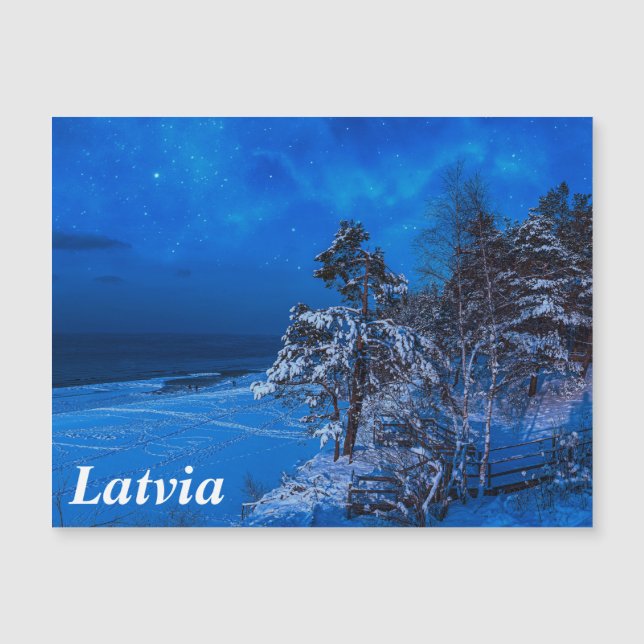 Nighttime winter scene with snow covered pines (Front)