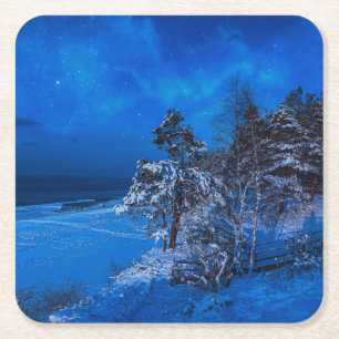 Nighttime winter scene with snow covered pines square paper coaster