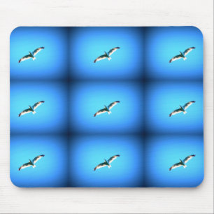 nine soaring gulls on blue mousepad