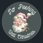 No peeking until Christmas fun pink Santa Classic Round Sticker<br><div class="desc">No peeking until Christmas featuring a smiling Santa with a pink hat.</div>