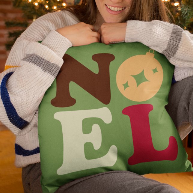Noel Modern Festive Retro Typography Christmas Cushion (This green pillow in retro colors spells out Noel in vintage typography.)