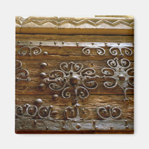 Norman iron scroll work on wooden door magnet