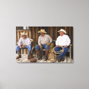 North America, USA. Cowboys relaxing and Canvas Print