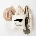 North Carolina Wedding Welcome Tote Bag<br><div class="desc">Welcome out of town wedding guests with a bag full of snacks and treats personalised with the state where you're getting married and the bride and groom's names and wedding date. Click Customise It to move the heart to show any city or location on the state map. Use the design...</div>