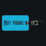 Not Yours Luggage Tag<br><div class="desc">This Not Yours luggage tag is a clever way to tell the people at the luggage carousel to keep looking. It features a vibrant,  blue background and bold,  black lettering that reads,  "Not yours!" The opposite side is ready for customising.</div>