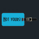 Not Yours Luggage Tag<br><div class="desc">This Not Yours luggage tag is a clever way to tell the people at the luggage carousel to keep looking. It features a vibrant,  blue background and bold,  black lettering that reads,  "Not yours!" The opposite side is ready for customising.</div>