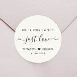 Nothing Fancy Just Love Cream Wedding Classic Round Sticker<br><div class="desc">A chic light cream sticker for your wedding invitations,  favours and thank you cards featuring "Nothing Fancy Just Love" showcased in a blend of simple lettering and an elegant script with swashes,  your first names joined together by a heart and your wedding or reception date.</div>