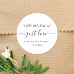 Nothing Fancy Just Love Wedding Classic Round Sticker<br><div class="desc">A chic sticker for your wedding invitations,  favours and thank you cards featuring "Nothing Fancy Just Love" in a blend of simple lettering and an elegant script with swashes,  and your names and wedding or reception date in classic serif typography.</div>