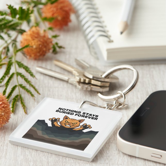 "NOTHING STAYS BURIED FOREVER" Orange Cat  Key Ring (Front Right)