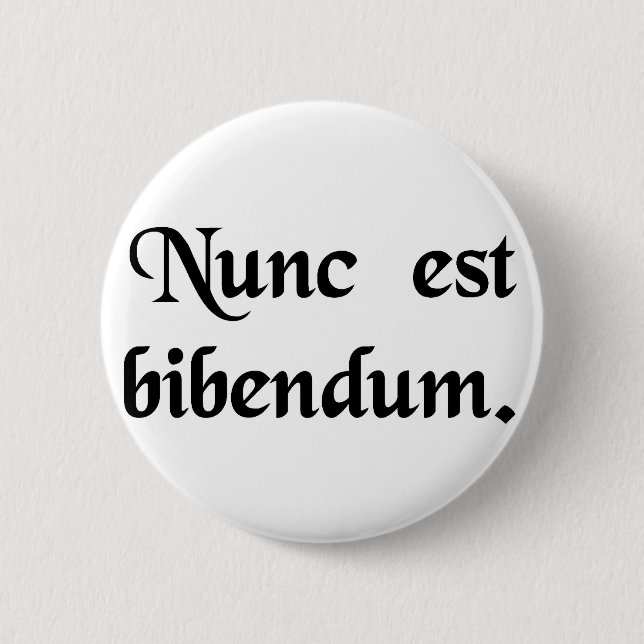 Now we must drink. 6 cm round badge (Front)