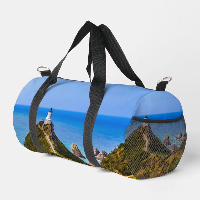 Nugget Point lighthouse, New Zealand Duffle Bag (Right Corner)