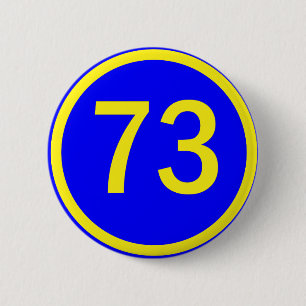 number, 73, in a circle 6 cm round badge