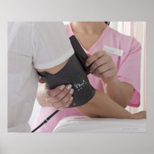 Nurse taking patient's blood pressure poster