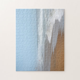 Ocean waves crashing on the beach by lighthouse jigsaw puzzle