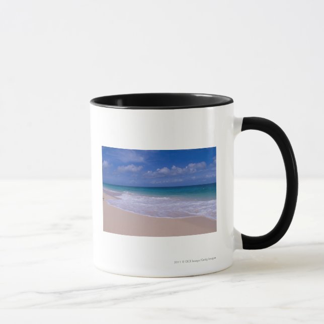 Ocean waves foaming onto sandy beach mug (Right)